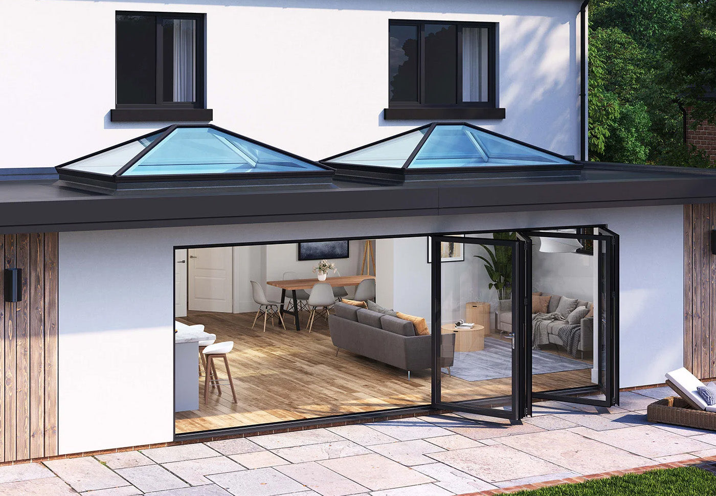 Showing a stunning Korniche Bi-Fold Door and 2 Korniche Roof Lanterns to show you have the right glazing products can enhance the Summer light in your home.